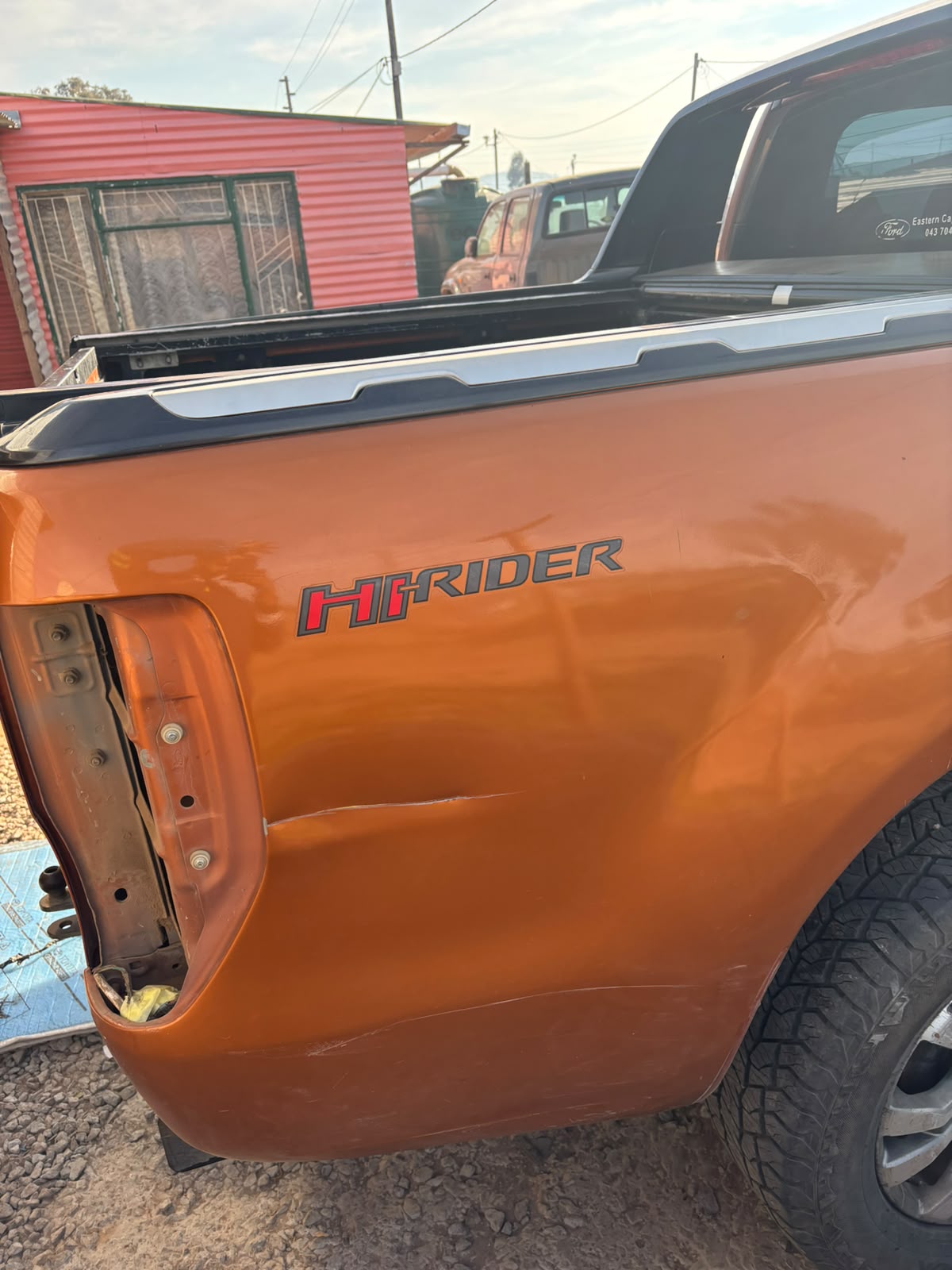 Ford Ranger Hi-Rider rear panel repaired and refinished in metallic orange
